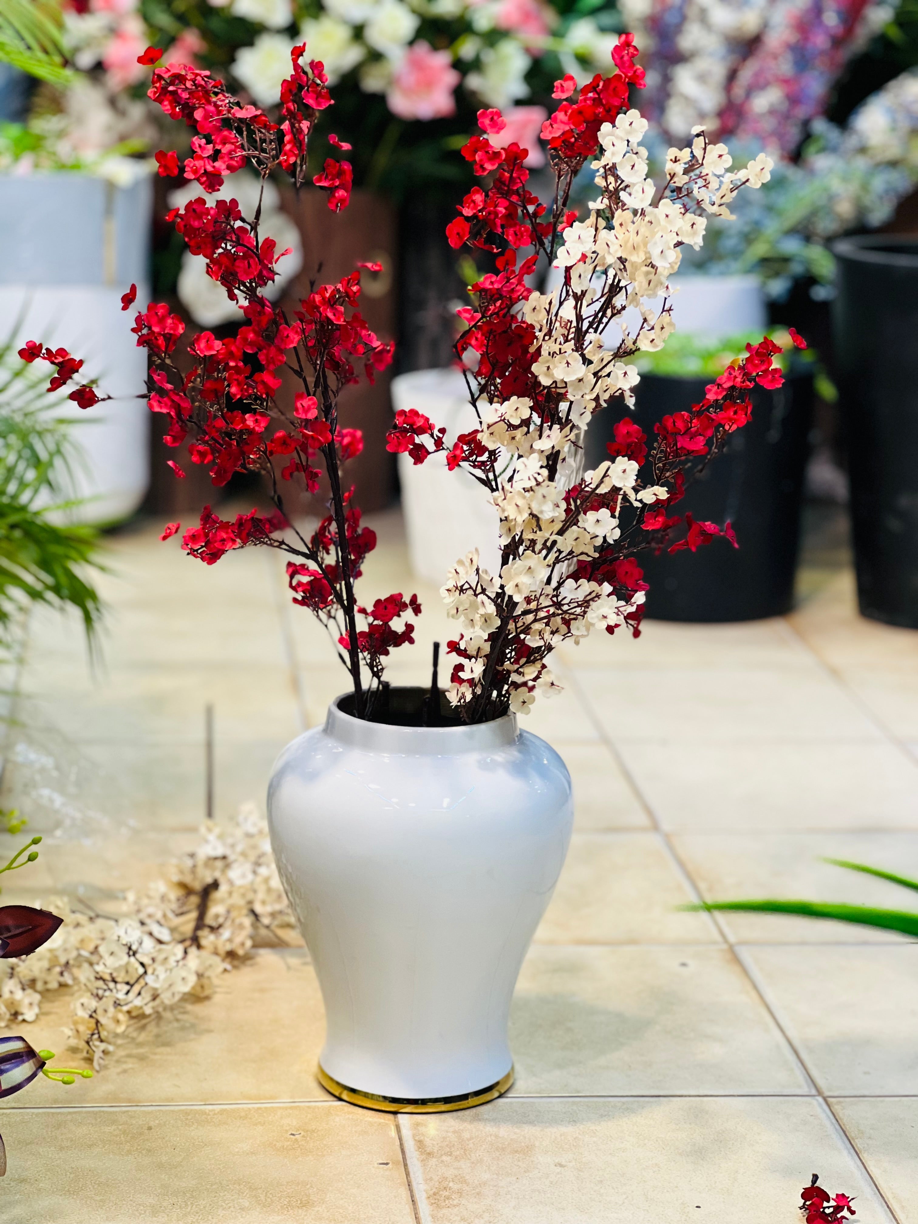 White urn with Gipso stems